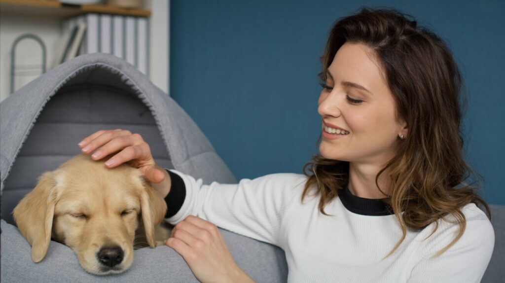 Certified trainer Sandie Calloway with a calm puppy, demonstrating a successful puppy schedule.